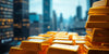 Close-up of gold bars with a financial skyline backdrop.