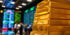 Close-up of gold bars on a trading floor.